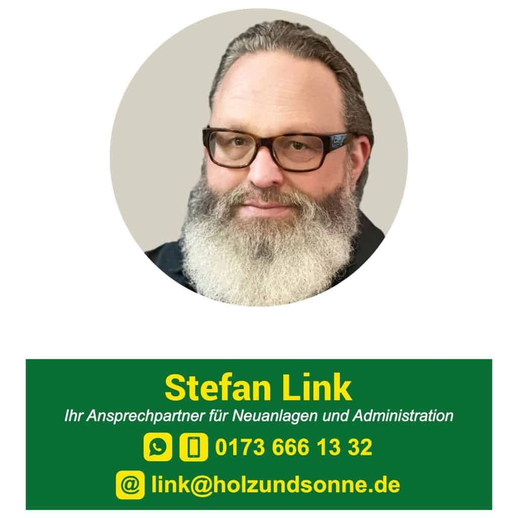 Rundes Profilbild der Geschäftsleitung Stefan Link (ca. 60 Jahre alt, graue Haare, großer Bart, schwarze Brille, offnerer freundlicher Blick und seine Kontaktdaten darunter (Kontakt können Sie über unsere Kontaktseite aufnehmen)